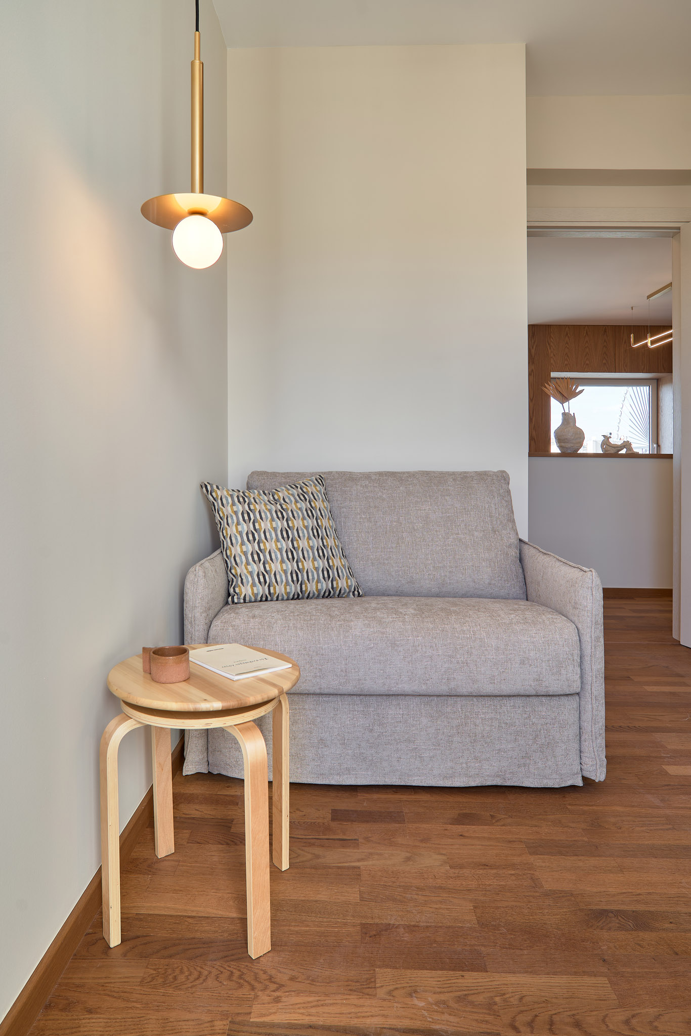 Office and host room of a renovated apartment in Thessaloniki with large openings