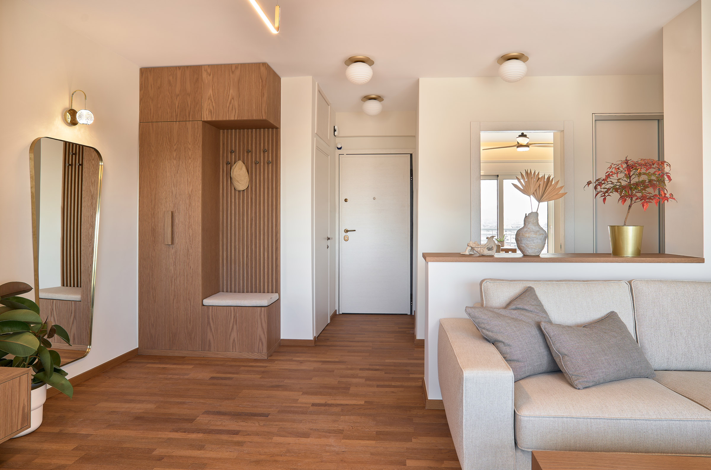 Living room and hall of a renovated apartment in Thessaloniki with large openings
