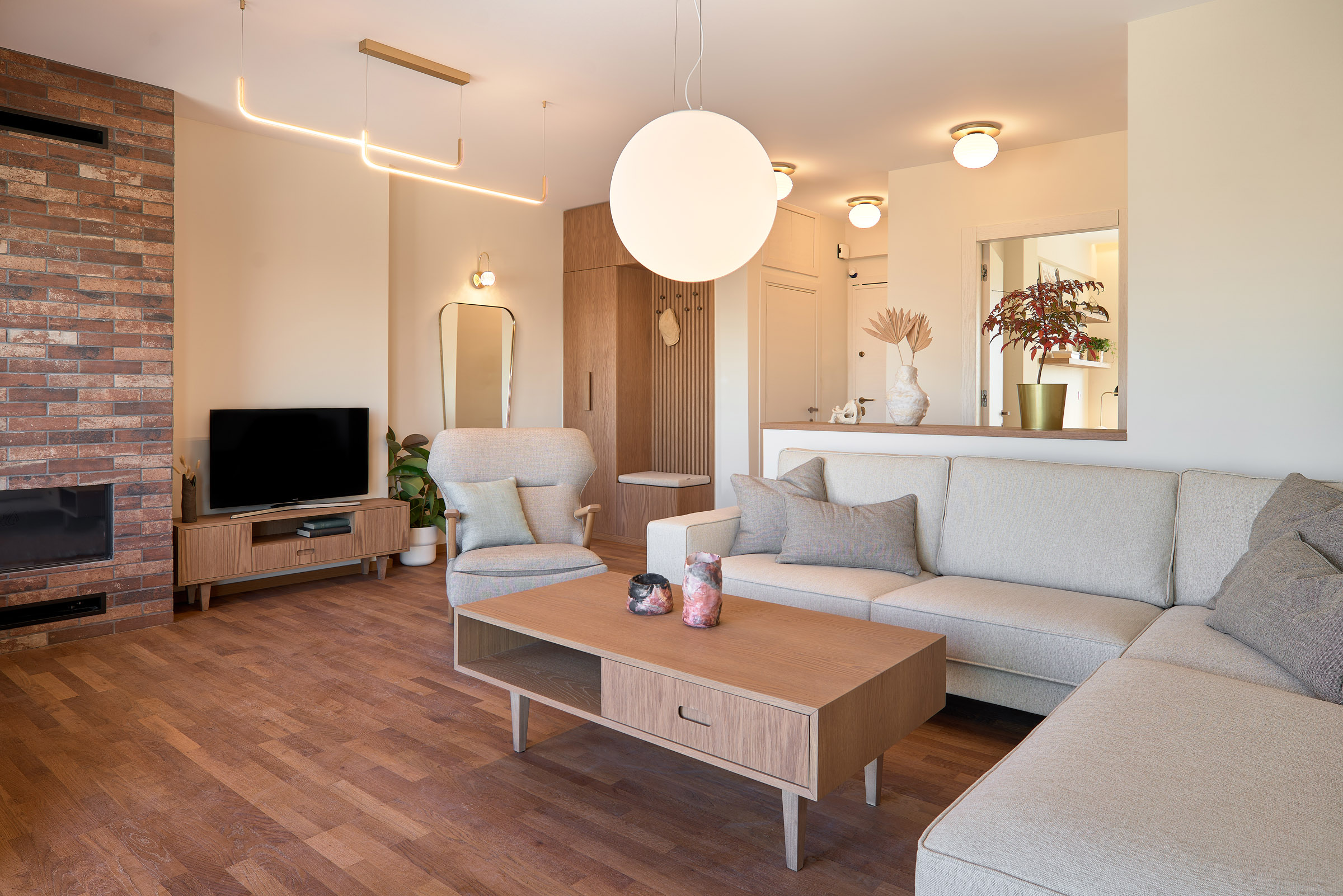 Living room and hall of a renovated apartment in Thessaloniki with large openings