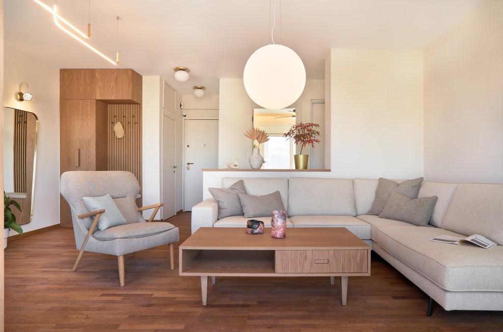 Living room and hall of a renovated apartment in Thessaloniki with large openings
