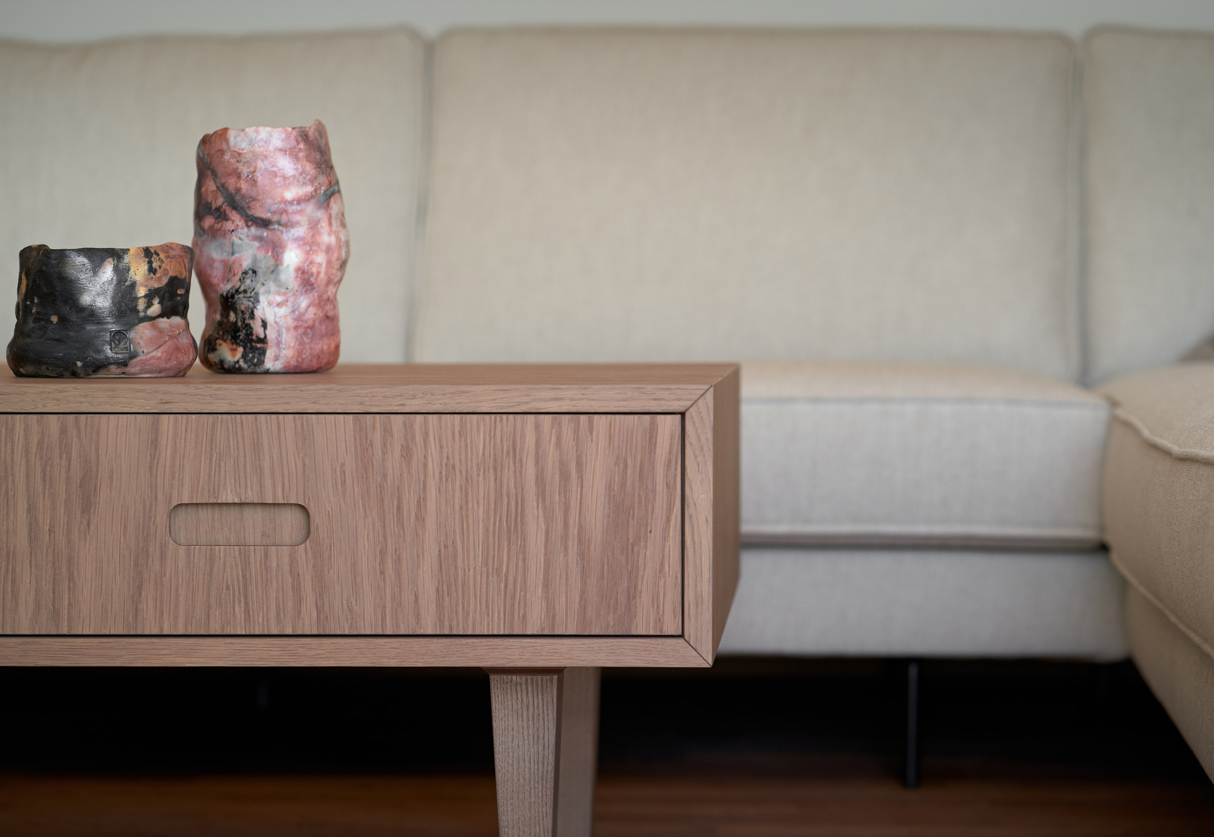 Living room of a renovated apartment in Thessaloniki - sofa gand table detail