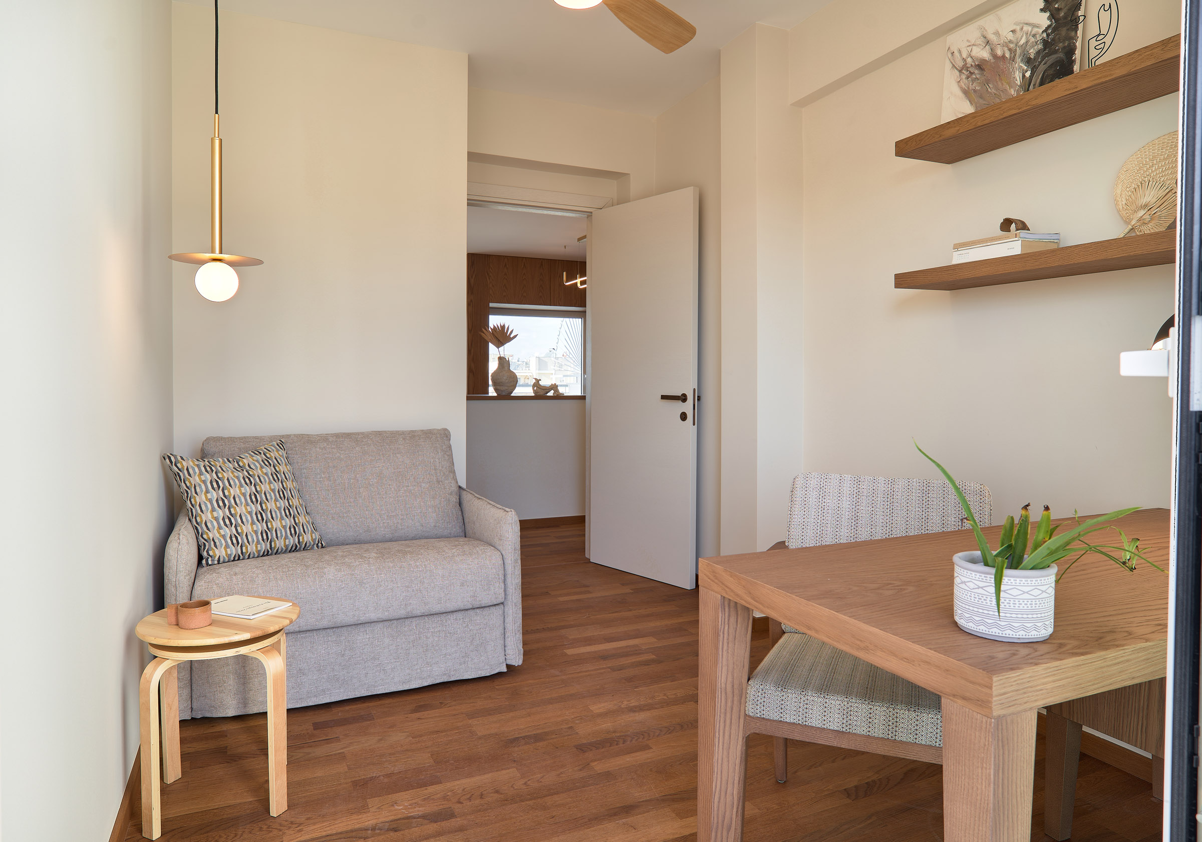 Office and host room of a renovated apartment in Thessaloniki