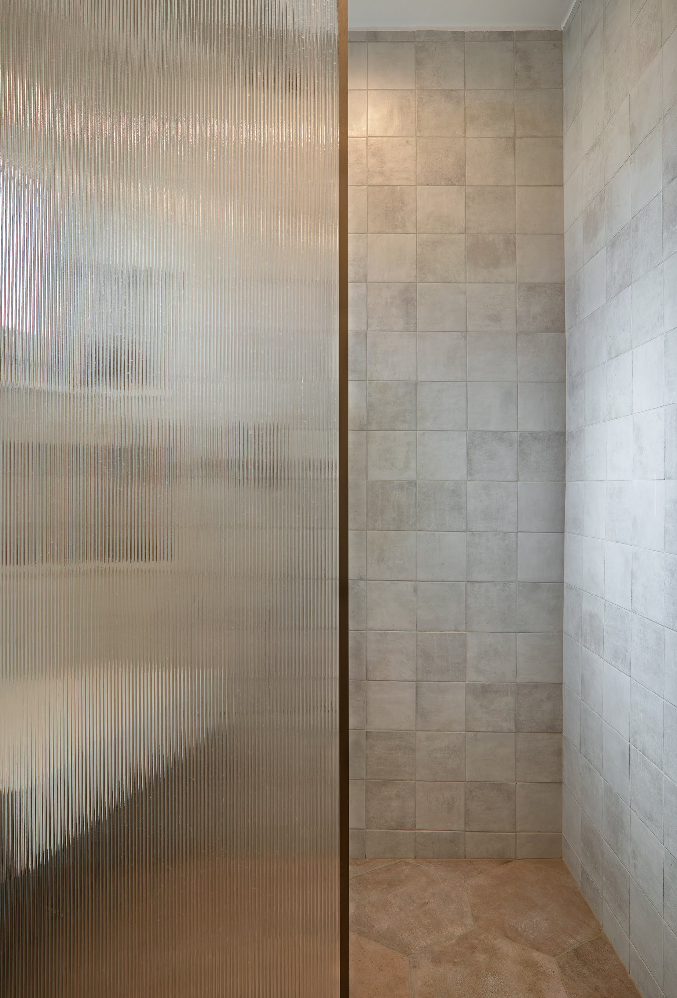 Shower with glass divider of a renovated apartment in Thessaloniki